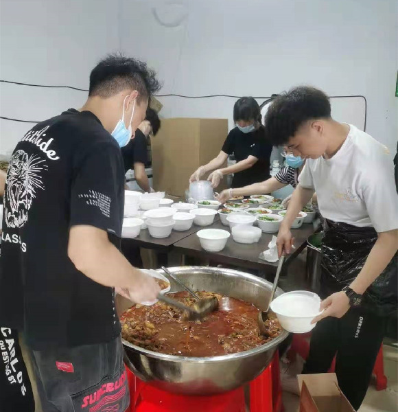 Several employees were distributing meals for donation.